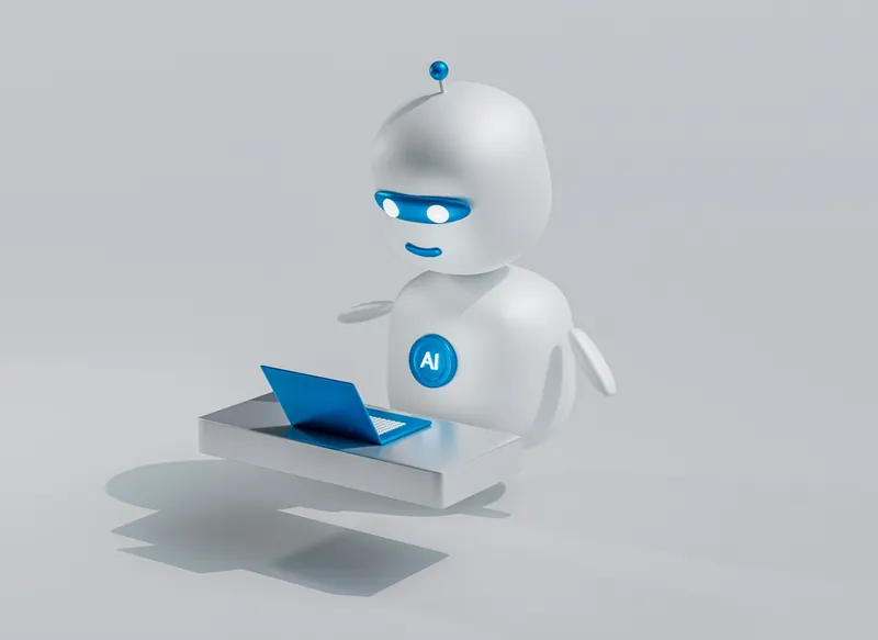 Pequeño robot blanco con un portátil
